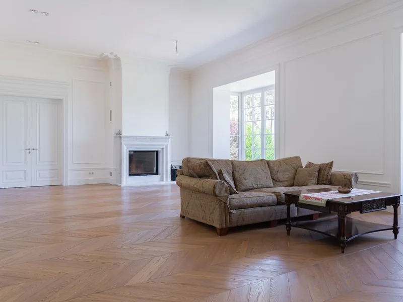 Living room with wood floors and a fireplace